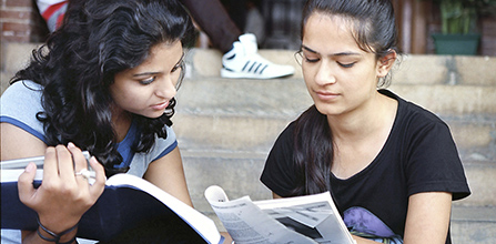 Photo of 2 students working together